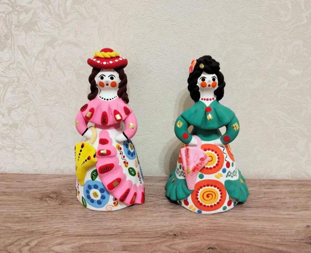 A collection of colorful Dymkovo toys, depicting ladies in traditional dress and animals, Painted clay, All-Russian Decorative Art Museum, Moscow
